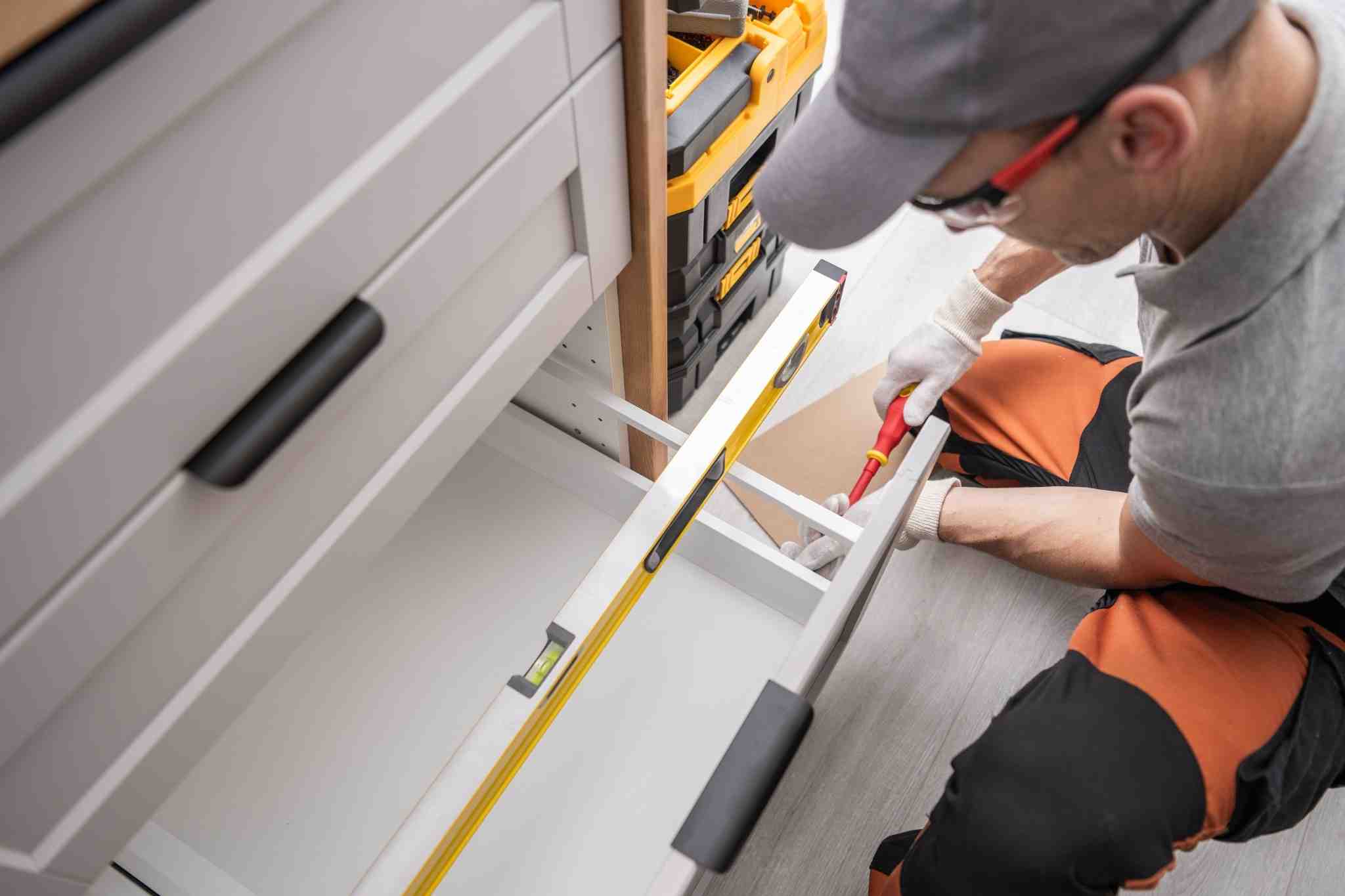 Men installing office drawers