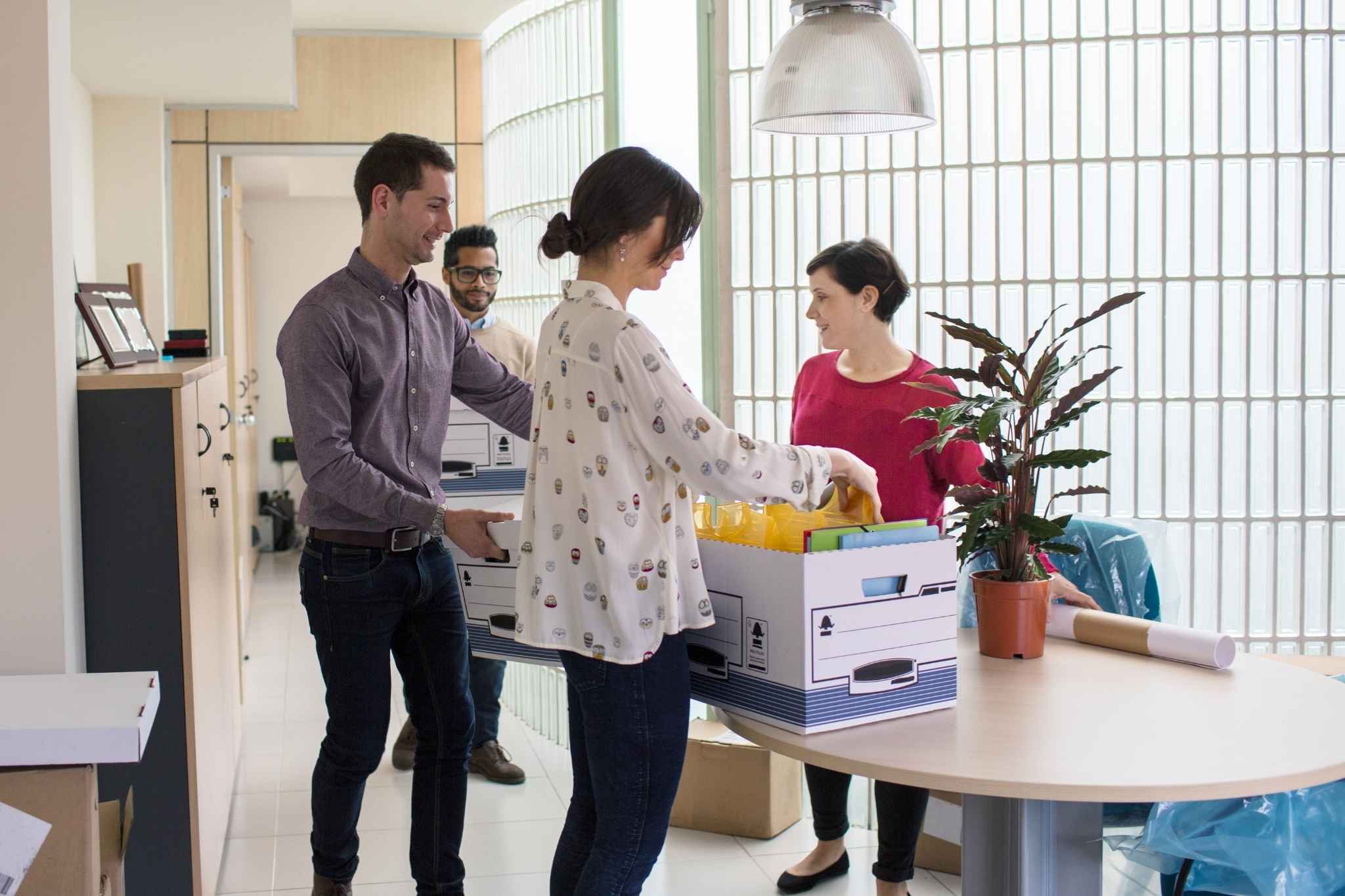 Employees packing office stuffs in the box
