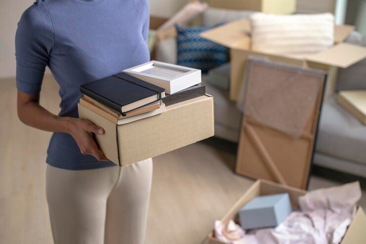 young woman moving into new apartment