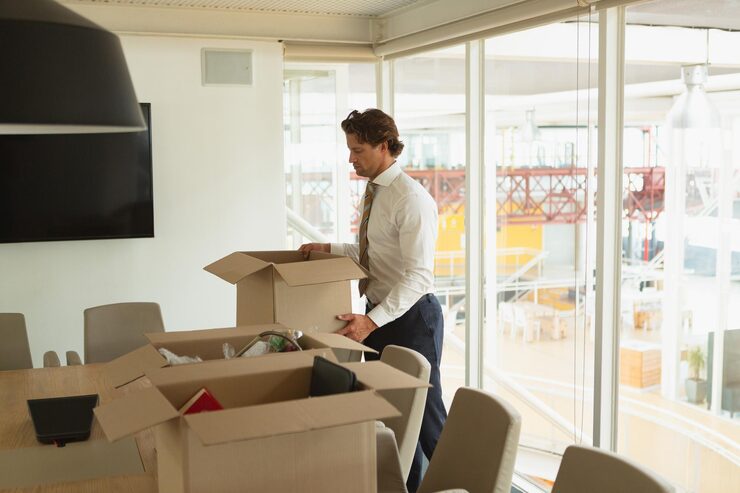 man holding cardboard box