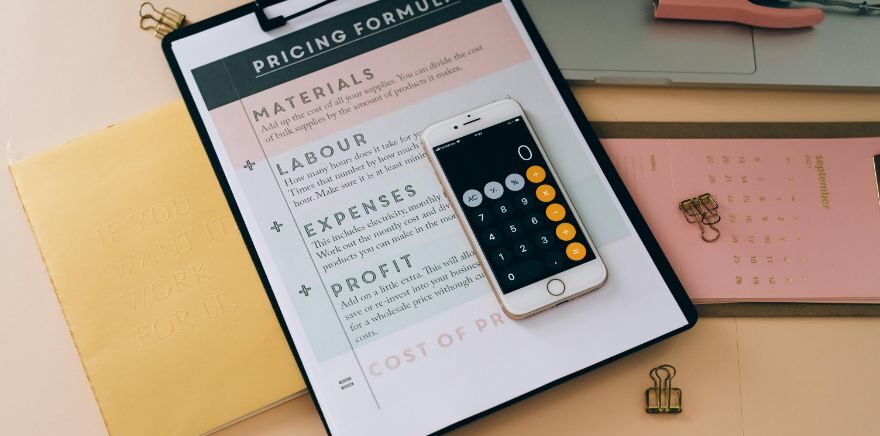 White Mobile Phone on Black Clipboard with White Paper