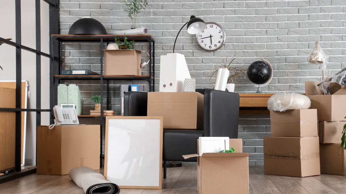 Cardboard moving boxes and office supplies