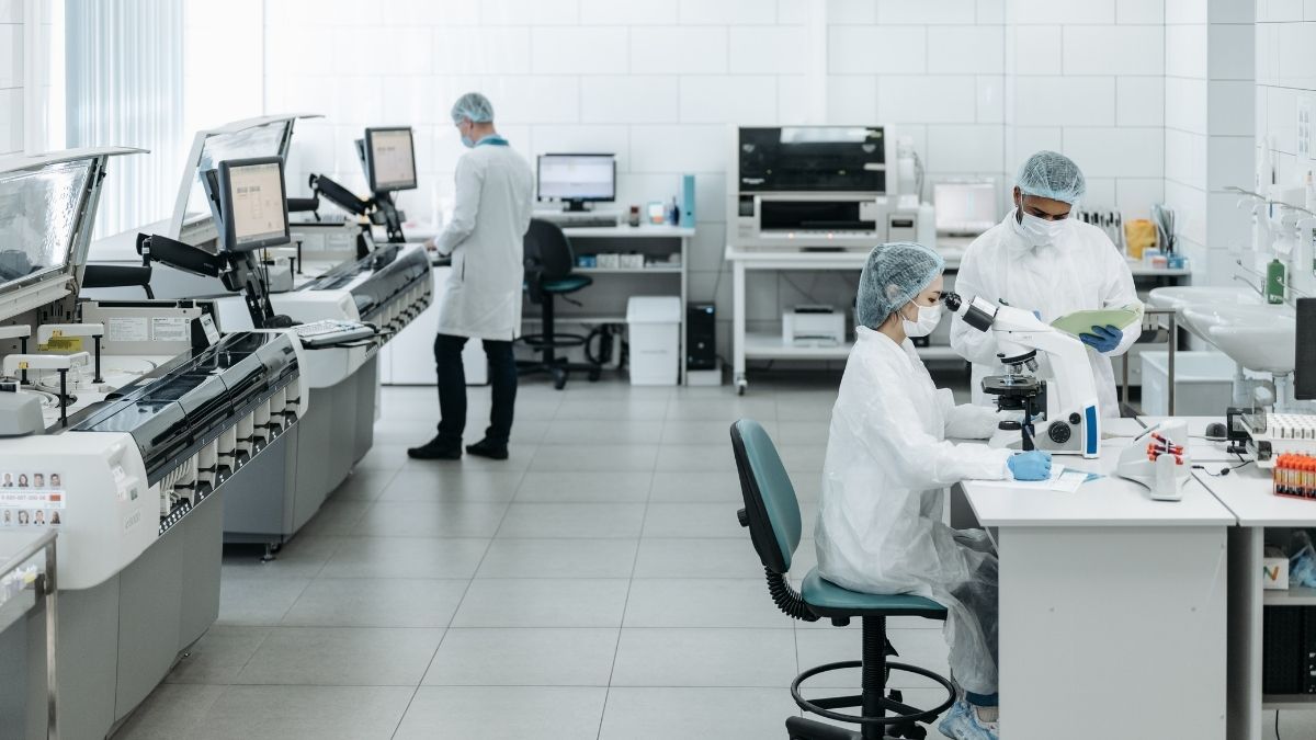 Scientists in white lab coats
